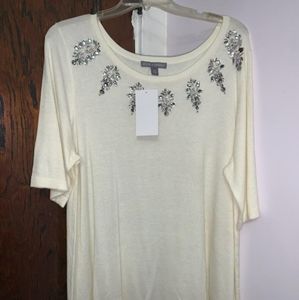 A never worn creamy blouse